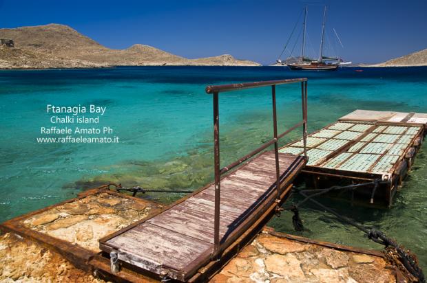Chalki-island-summer-sailing-boat-greece-holiday-sea-landscape-seascape-Ftanagia-bay-harbour-Grecia-halki-beach-vacanze-mare-veliero